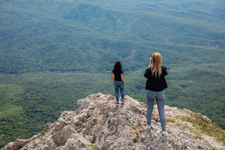 women on a hike looking at the mountains, nature, tourismの写真素材