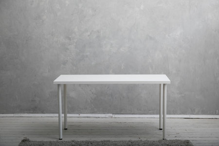 interior white table on a gray background in the roomの写真素材