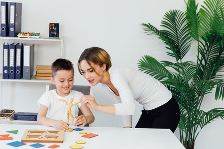 a boy with a psychologist in the office plays board gamesの写真素材