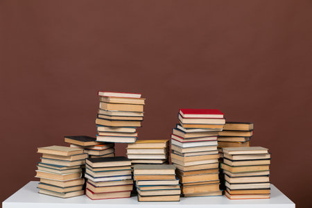 learning literacy science education stack of books on a brown backgroundの写真素材