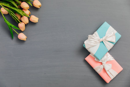 gifts with flowers on a gray background holiday artの写真素材
