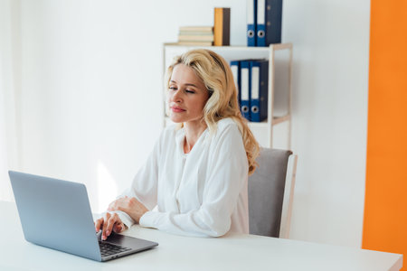 remote work communication woman with laptop computer internet conversation online communicationの写真素材