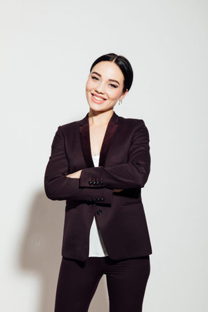 business woman at work in the office stands in a business suit