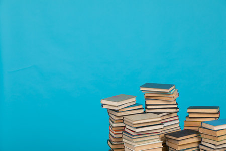 learning library science stack of books on a blue backgroundの写真素材