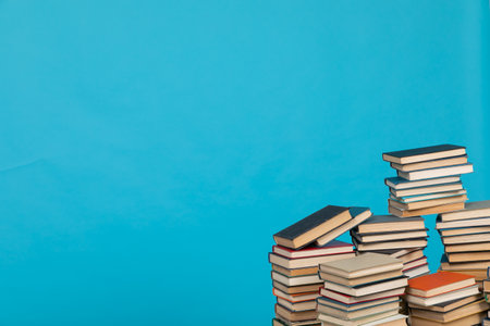 learning library science stack of books on a blue backgroundの写真素材