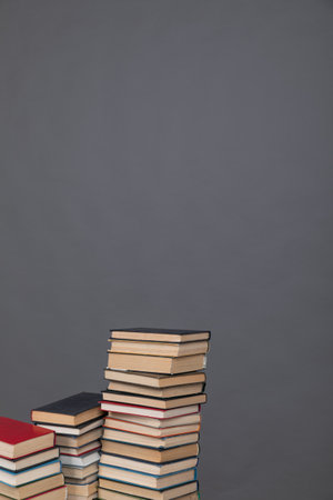 stack of books on grey background learning library learning scienceの写真素材
