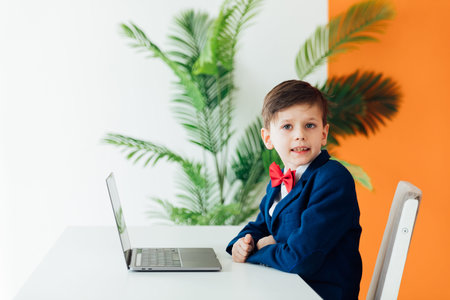 a student sits at a laptop in a school IT education classroom