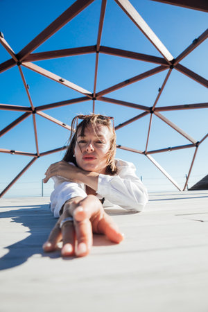 woman at a large wooden structure walkの写真素材