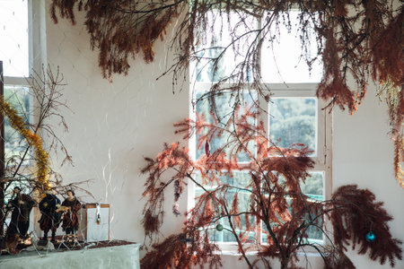 red Christmas trees with toys by the windowの写真素材