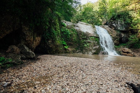 mountain stream among the rocks in the forest in nature journey hikingの写真素材