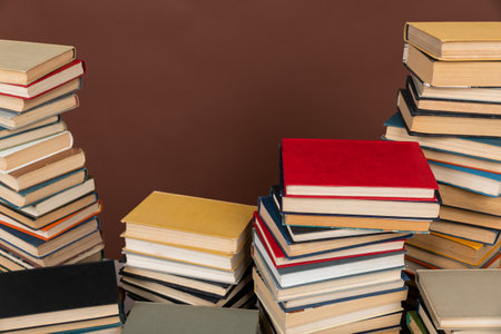 science a lot of books on a brown background reading in the library in the knowledge roomの写真素材