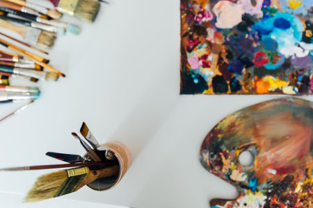 brushes for drawing palette with paints different colors artの写真素材