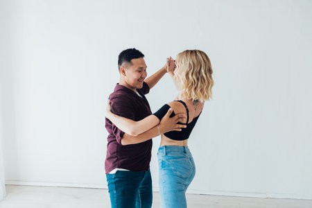 dancing couple in motion in bachata dance studio pair dance kizomba salsa latinaの写真素材