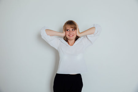 woman covered her ears with her hands I cant hearの写真素材
