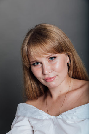 portrait of a beautiful woman on a gray background