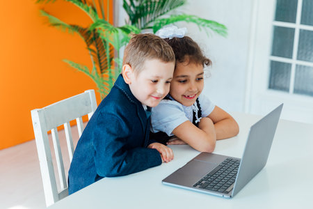 Boy and girl learning watching laptopの写真素材