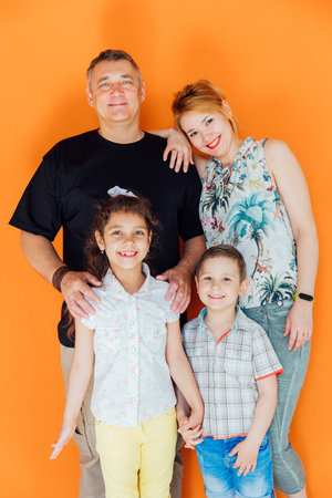 Family photo of mom with dad and son with daughter