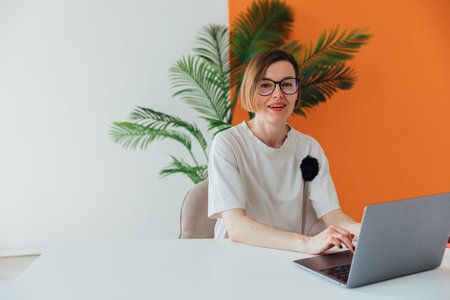 Business woman working online at computer in officeの写真素材