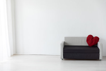 Black and grey office sofa in white room interior with windowの写真素材