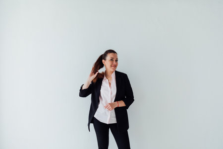 Beautiful 40 year old woman in business suit in officeの写真素材