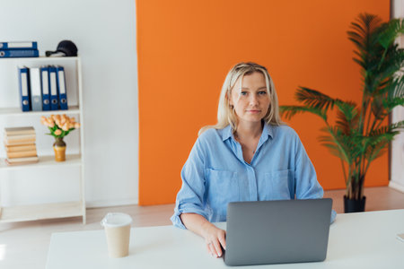 Business woman executive at work in office at computerの写真素材