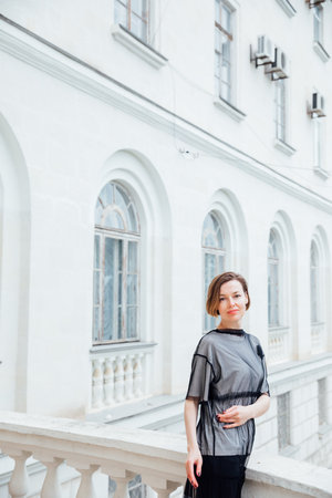 Portrait of beautiful slender fashionable brunette womanの写真素材