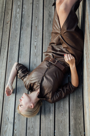 blonde lying on wooden floor walk restの写真素材