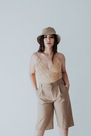 Beautiful brunette in panama hat on white backgroundの写真素材