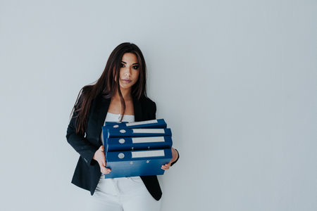 Woman business woman with folders in office spaceの写真素材