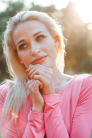 Portrait of a beautiful blonde woman in natureの写真素材