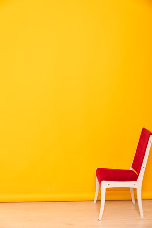 red chair on yellow background interior furniture minimalismの写真素材