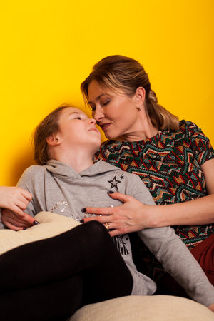 Mom and daughter hugging family together loveの写真素材