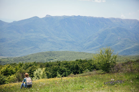 Woman on a hike looking at nature tourism