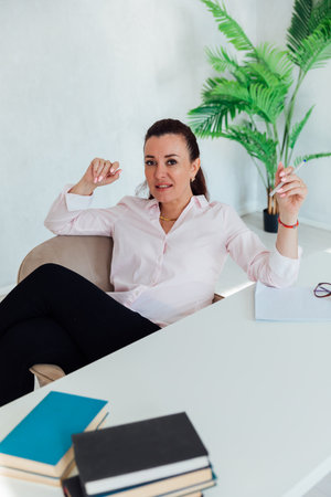 Business woman at desk in officeの写真素材