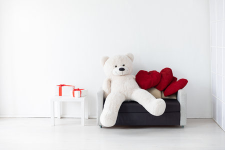 Grey office sofa with gifts in room interiorの写真素材