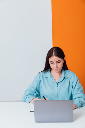 Business woman working on computer online in office