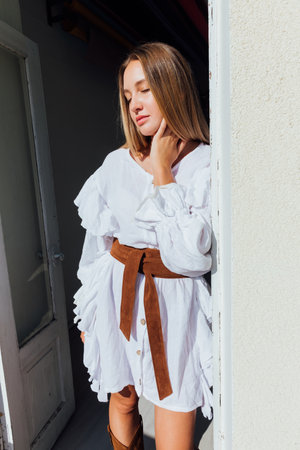 Beautiful fashionable woman in white vintage western dressの写真素材