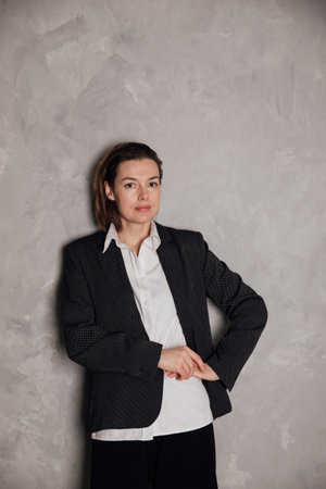 Business woman on gray background in officeの写真素材