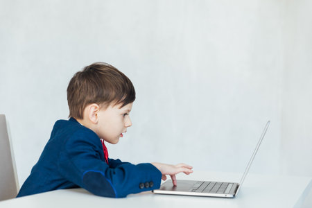 Young business boy. smiling child in glasses. little boss in office.funny kidsの写真素材
