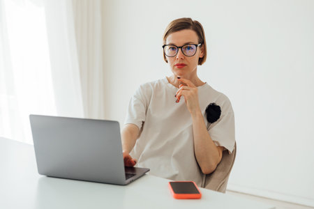 Business woman working online at computer in officeの写真素材