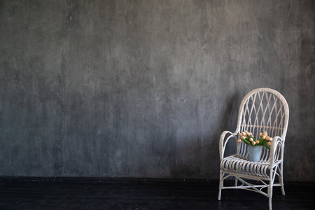 Vintage armchair with flowers in grey room interiorの写真素材