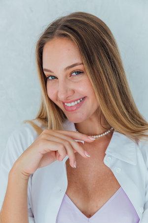 Portrait of a beautiful blonde woman in a dressの写真素材