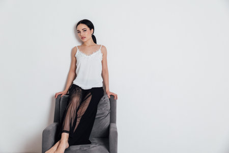 Portrait of beautiful fashionable young woman in home clothesの写真素材