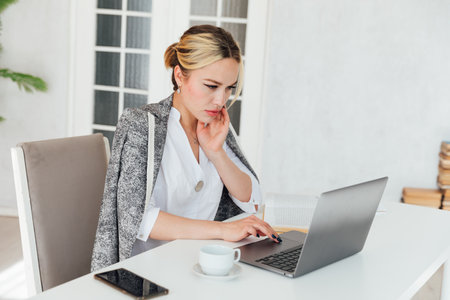 Young busy business woman manager, lawyer or company employee holding accounting bookkeeping documentsの写真素材