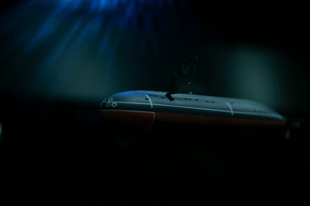Submarine sailing in the dark sea water of the oceanの写真素材