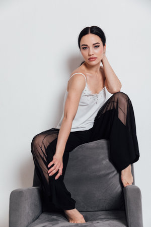 Beautiful fashionable woman posing in studioの写真素材