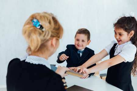 Teacher teaching children in school classroomの写真素材