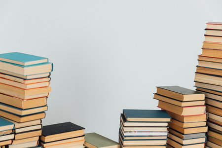 Stacks of old books in study library on white backgroundの写真素材
