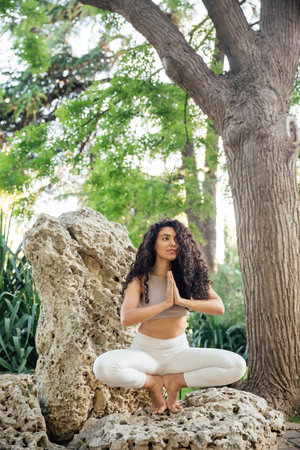 Woman doing yoga exercises asana breathing balanceの写真素材