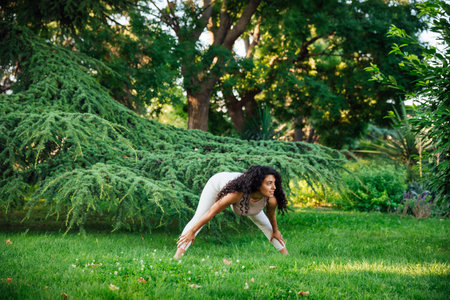 Woman doing yoga exercises asana breathing balanceの写真素材